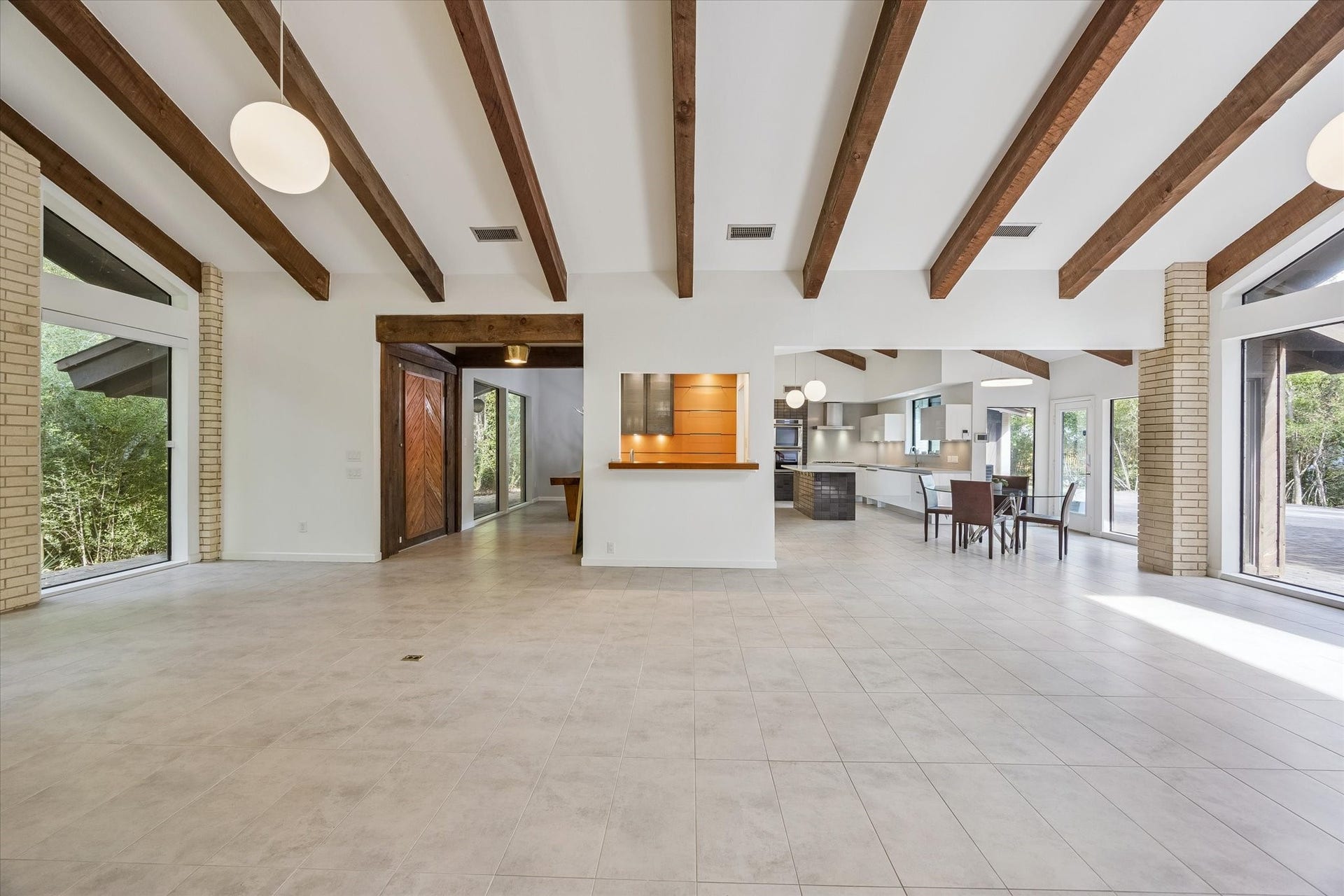 104 Gershwin Drive, Houston, TX 77079 Convenient bar area connects the living room & kitchen, featuring illuminated shelving, counter space & a built-in ice maker for easy entertaining.