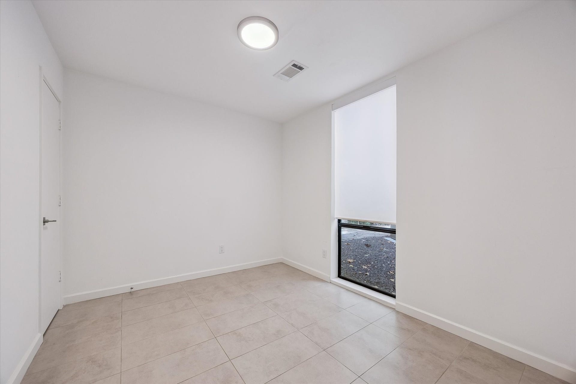 104 Gershwin Drive, Houston, TX 77079 Secondary bedroom w/tile flooring has convenient access to a nearby full bath w/shower.