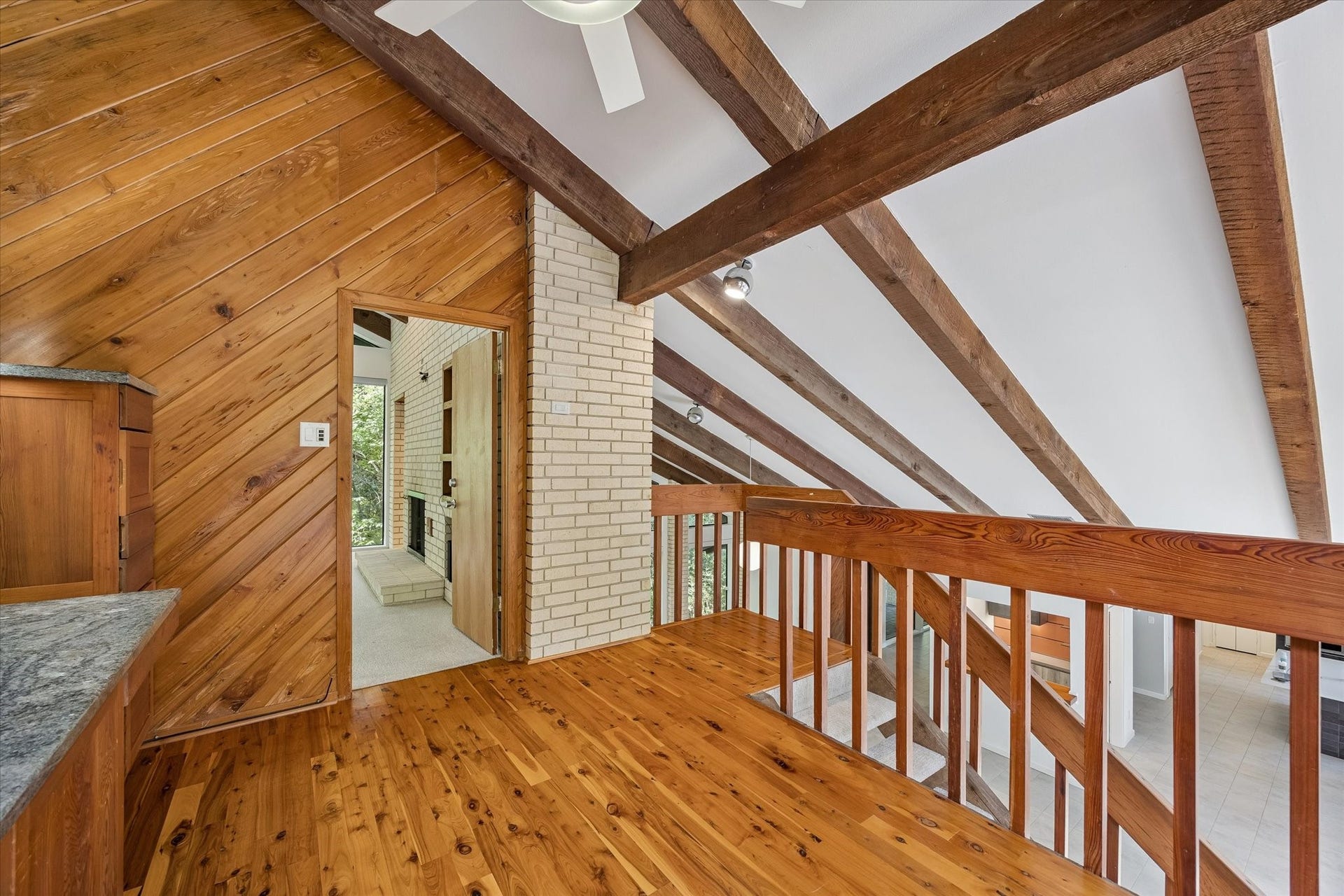 104 Gershwin Drive, Houston, TX 77079 Office overlooks the living areas below, creating an open connection between levels while Pecky Cypress wood & exposed beams continue the homes distinctive architectural character.