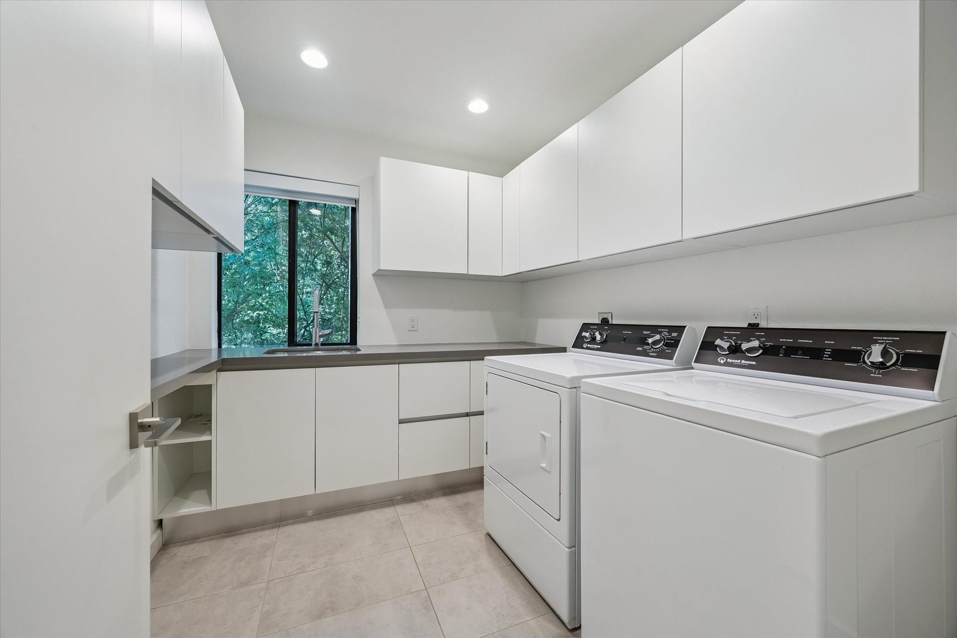 104 Gershwin Drive, Houston, TX 77079 Fantastic utility room offers extensive cabinetry, great storage, expansive countertop workspace, a utility sink & room for full-size laundry appliancesall designed to keep everyday tasks organized & efficient.
