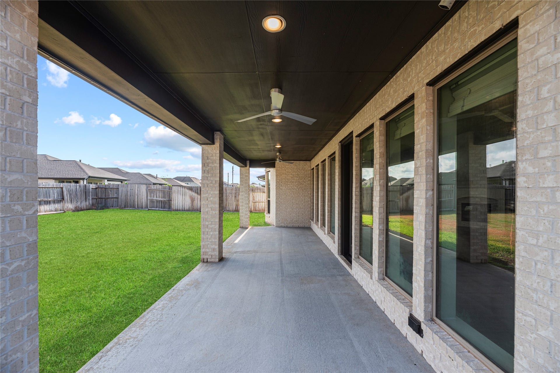 9511 Shaded Tree Drive, Missouri City, TX 77459 Covered patio with recessed lights, ceiling fan, and even a gas-line for your future outdoor kitchen!