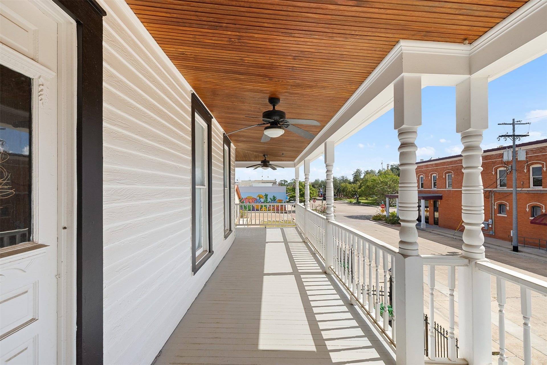 326 W Colorado Street, La Grange, TX 78945 The long upper balcony captures the romance of Southern living and offers views toward the heart of La Grange.
