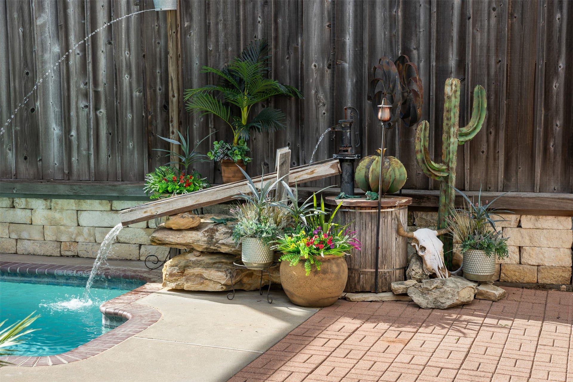 326 W Colorado Street, La Grange, TX 78945 A whimsical waterfall feature adds tranquility to the pool area.