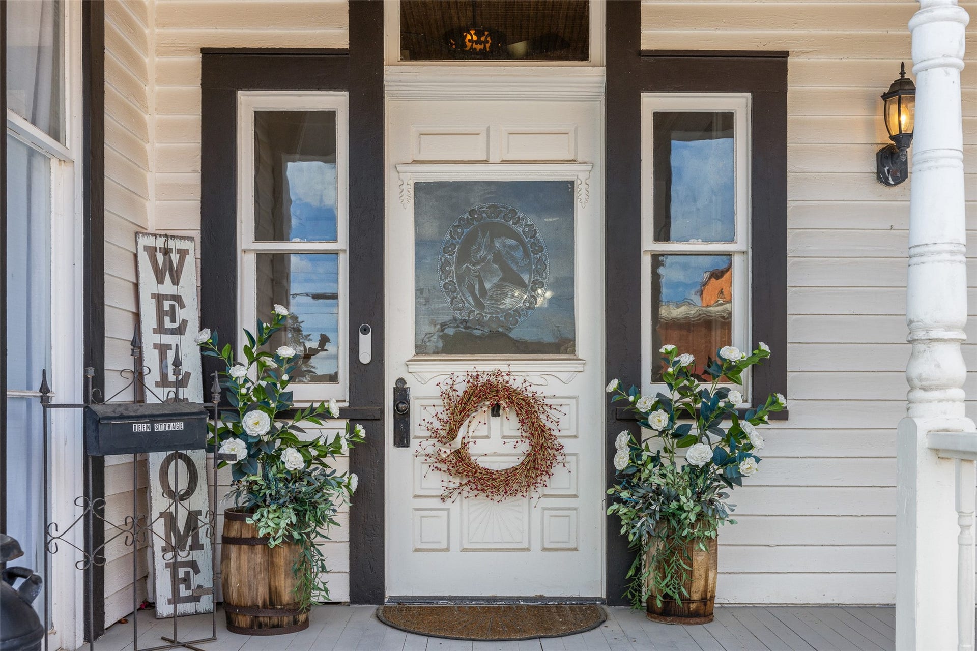 326 W Colorado Street, La Grange, TX 78945 Original acid-etched front door and doorbell with the welcoming porch introduce the homes remarkable historic character.