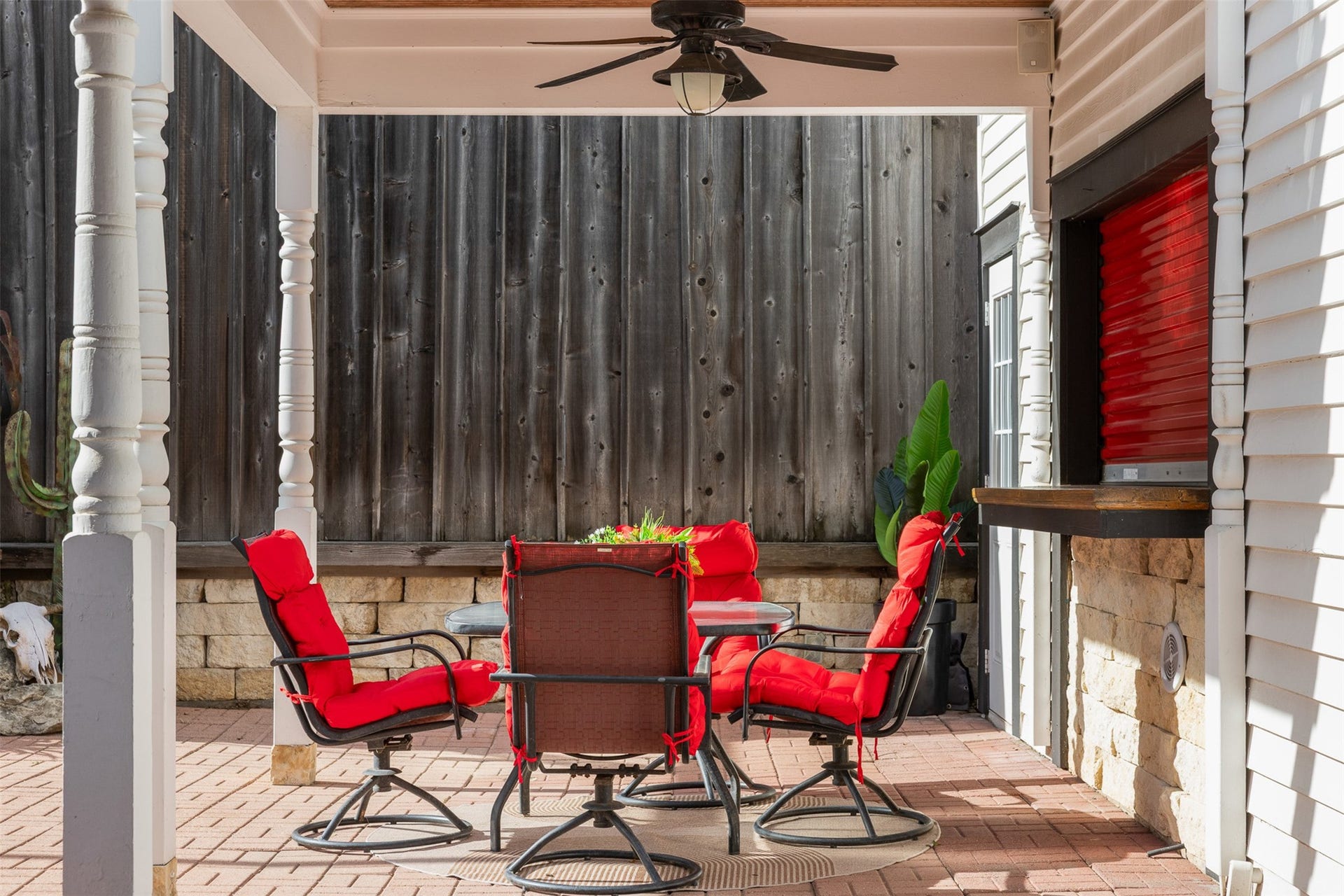 326 W Colorado Street, La Grange, TX 78945 A covered outdoor sitting area offers a private place to relax or entertain beside the pool.