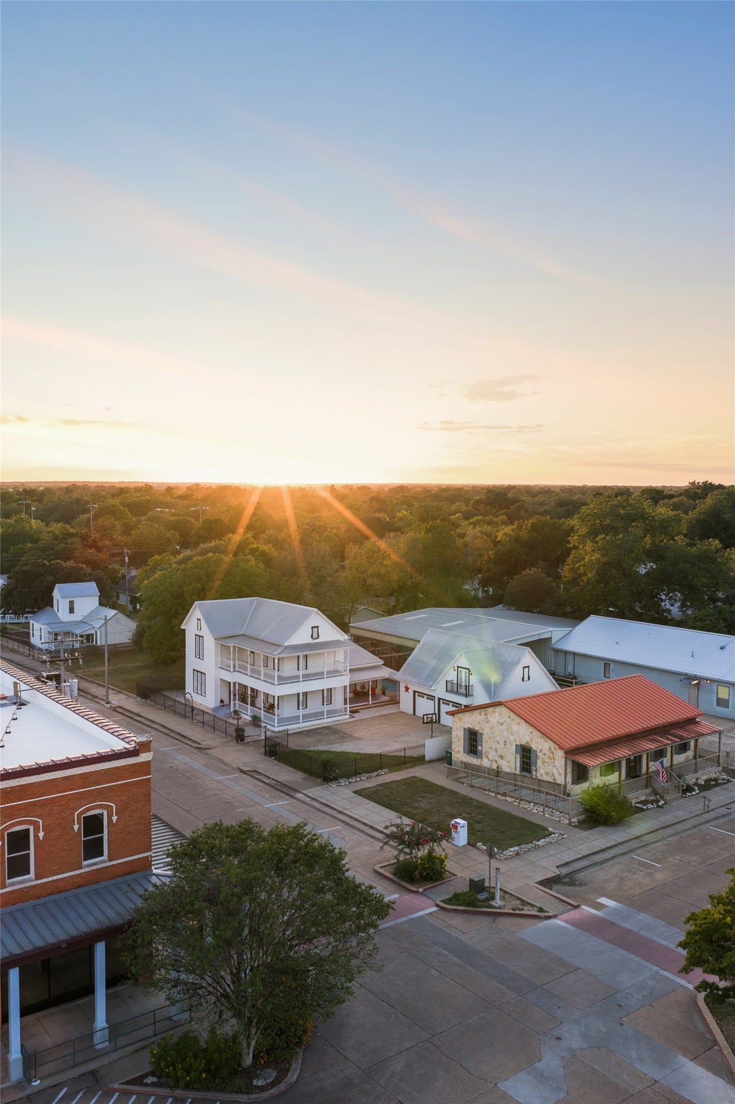 326 W Colorado Street, La Grange, TX 78945 An aerial view reveals the homes exceptional position just off La Granges historic downtown square.