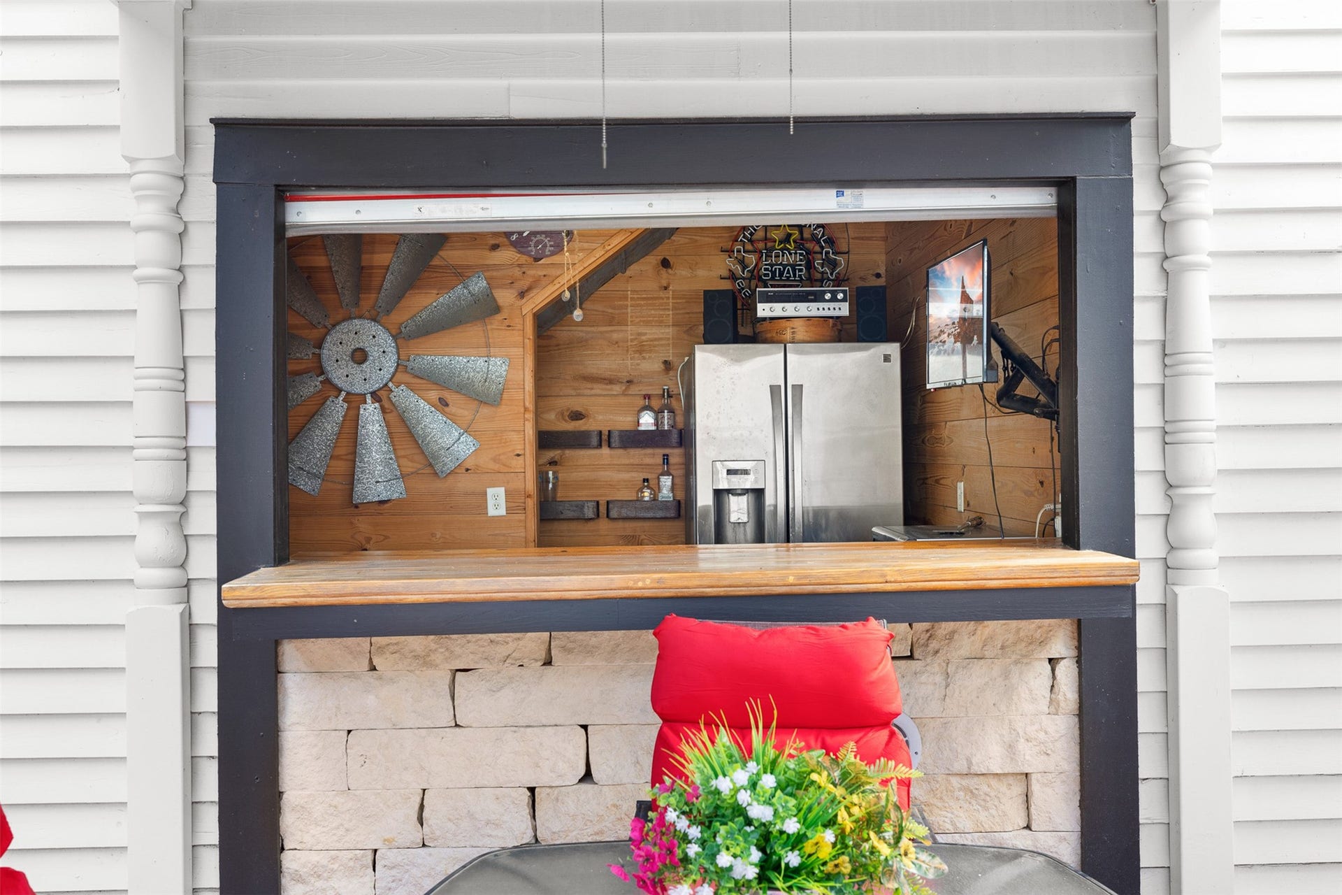 326 W Colorado Street, La Grange, TX 78945 The garage bars charming serving window adds personality and makes entertaining especially easy.