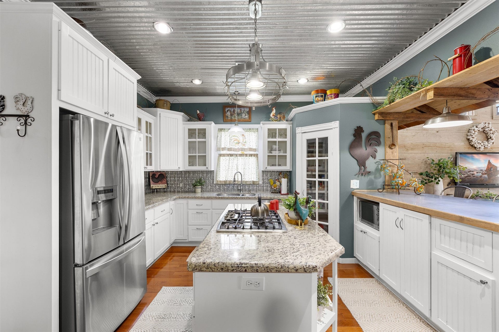 326 W Colorado Street, La Grange, TX 78945 The updated kitchen combines granite countertops, stainless appliances and generous cabinetry.