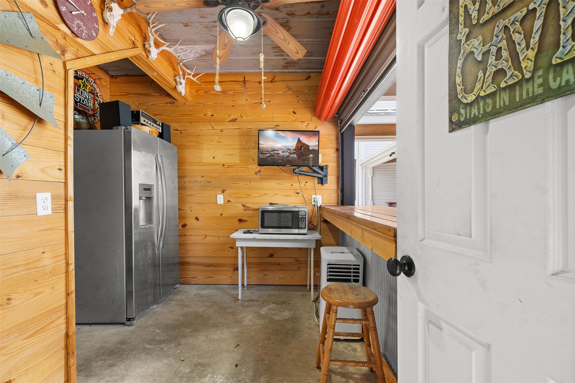326 W Colorado Street, La Grange, TX 78945 A casual bar and gathering area within the garage creates a fun and flexible extension of the property.