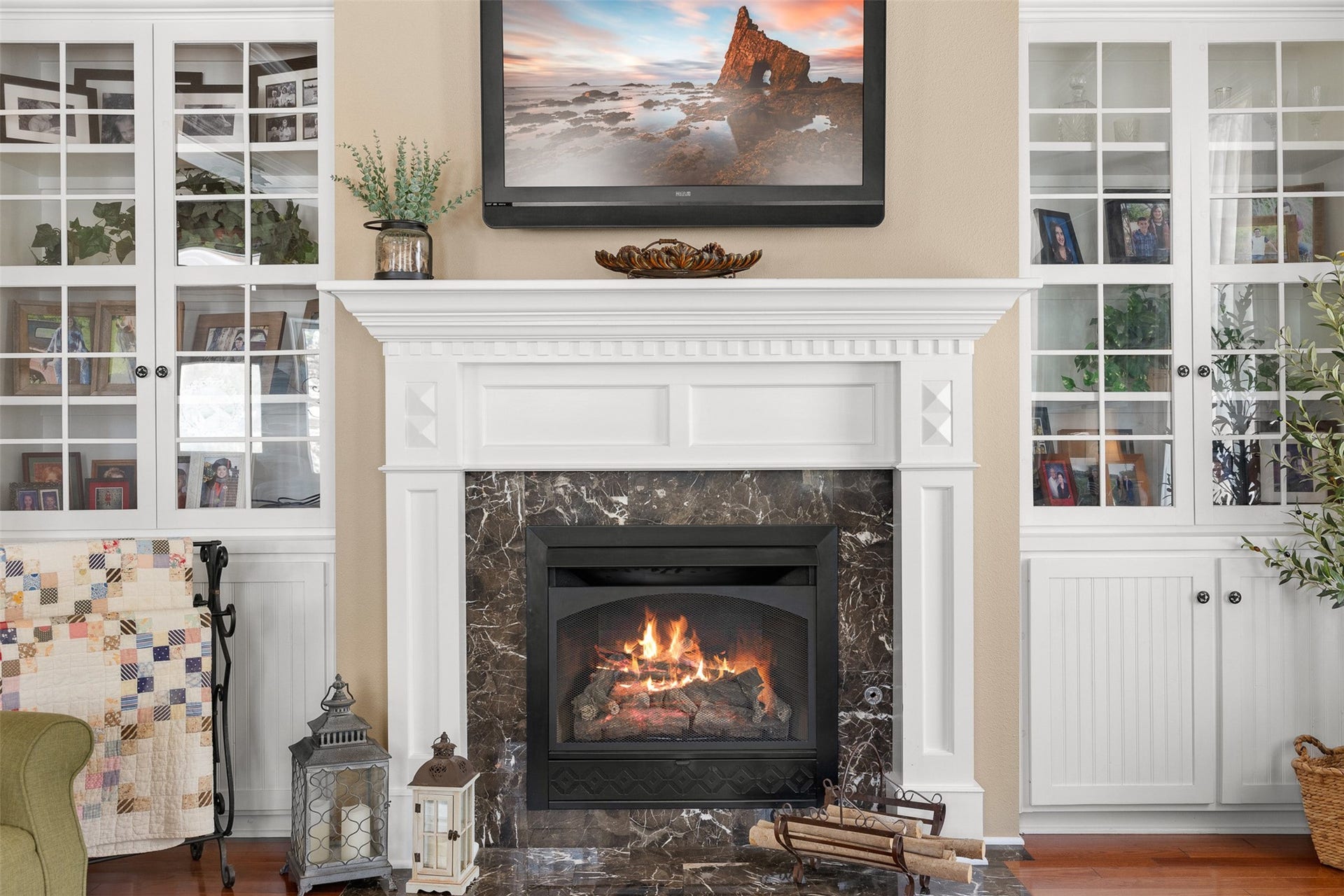 326 W Colorado Street, La Grange, TX 78945 A stately fireplace framed by custom built-ins creates an elegant focal point in the formal living room.