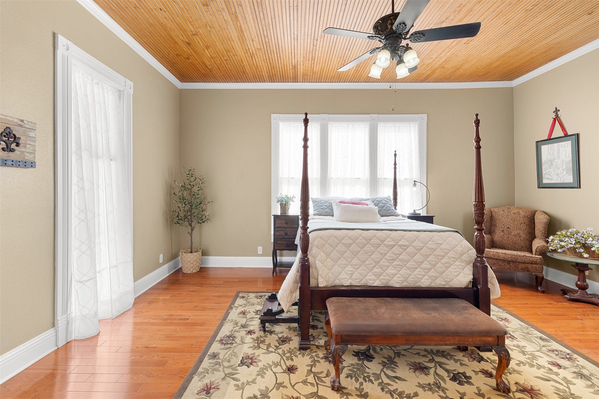 326 W Colorado Street, La Grange, TX 78945 Generous proportions, natural light and a private fireplace give the primary bedroom an inviting sense of comfort.