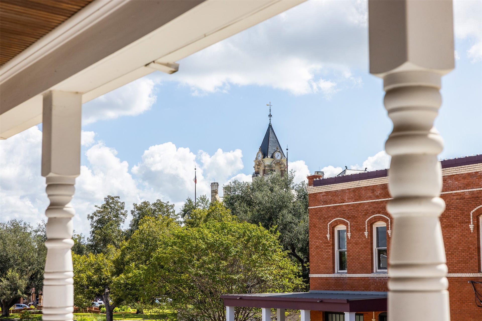 326 W Colorado Street, La Grange, TX 78945 Enjoy a front-row view of La Grange history from the comfort of home, with the iconic Fayette County Courthouse clock tower rising above the trees and downtown rooftops.