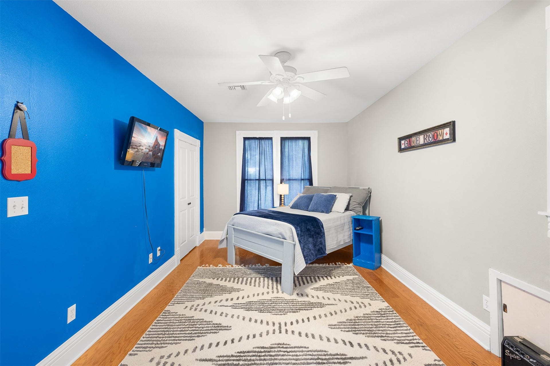 326 W Colorado Street, La Grange, TX 78945 A spacious secondary bedroom offers wood floors, high ceilings and plenty of flexibility for family or guests.
