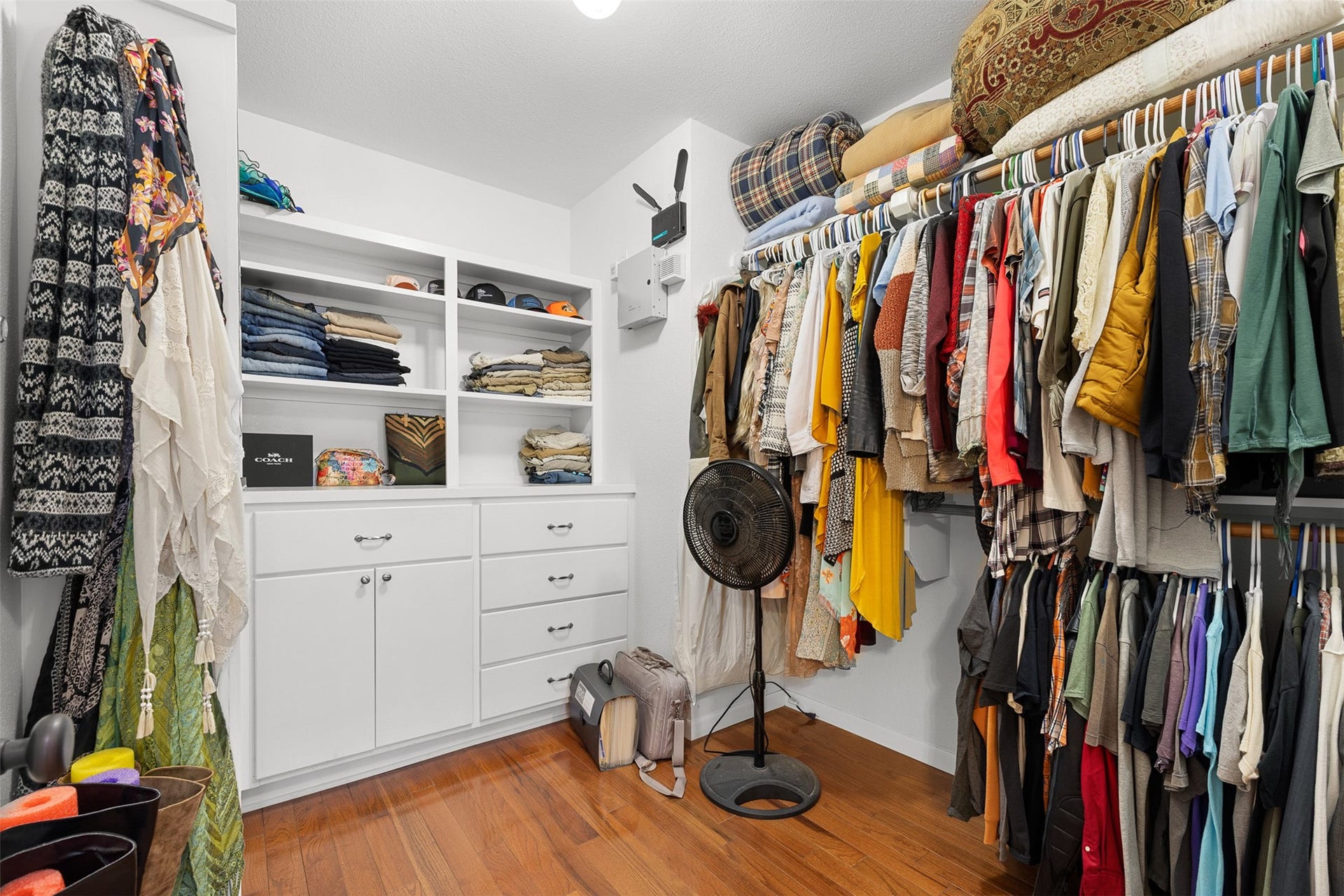 326 W Colorado Street, La Grange, TX 78945 The primary walk-in closet offers abundant hanging space, built-in storage and room to keep everything beautifully organized.