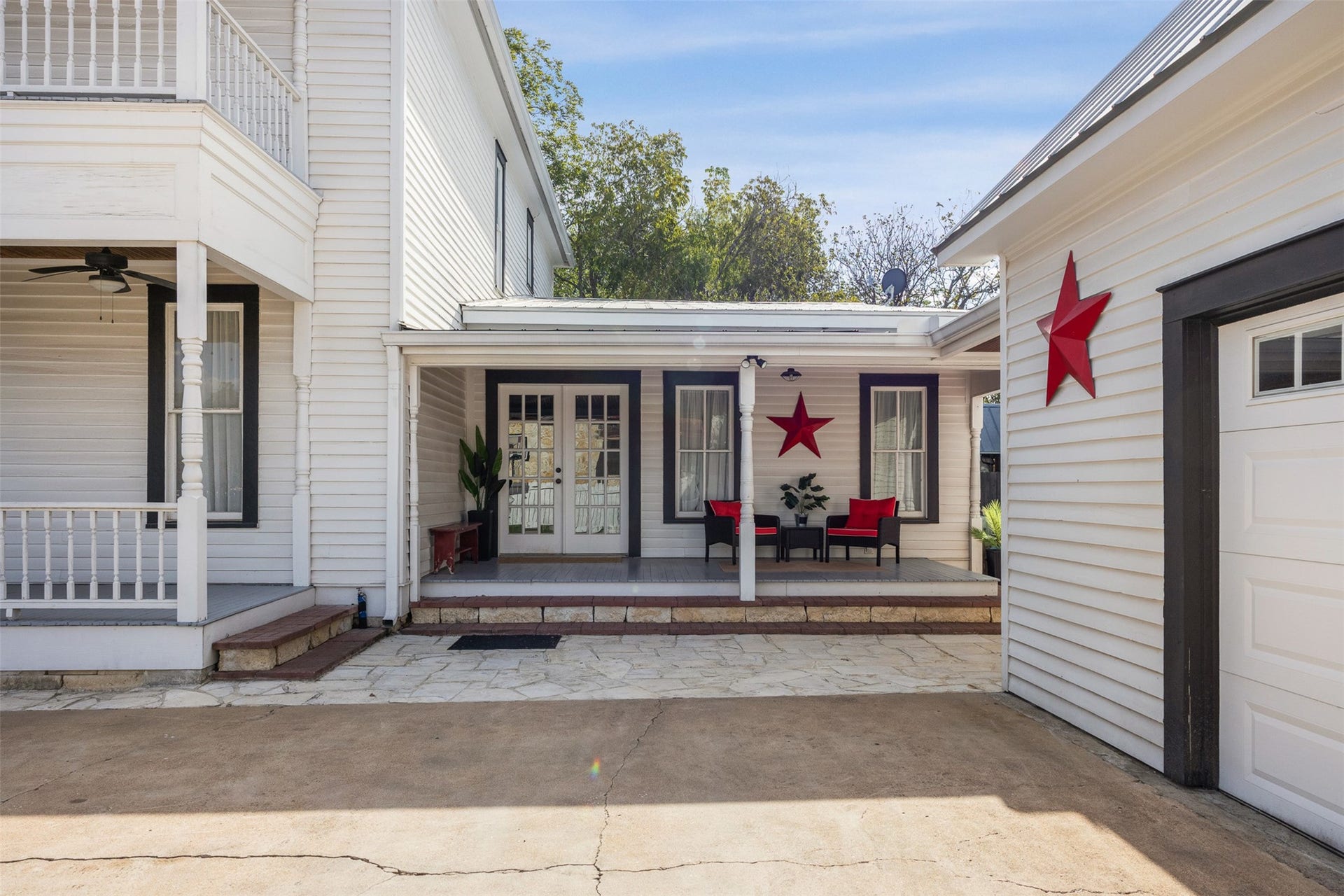 326 W Colorado Street, La Grange, TX 78945 The courtyard creates a charming connection between the historic residence and detached garage apartment.