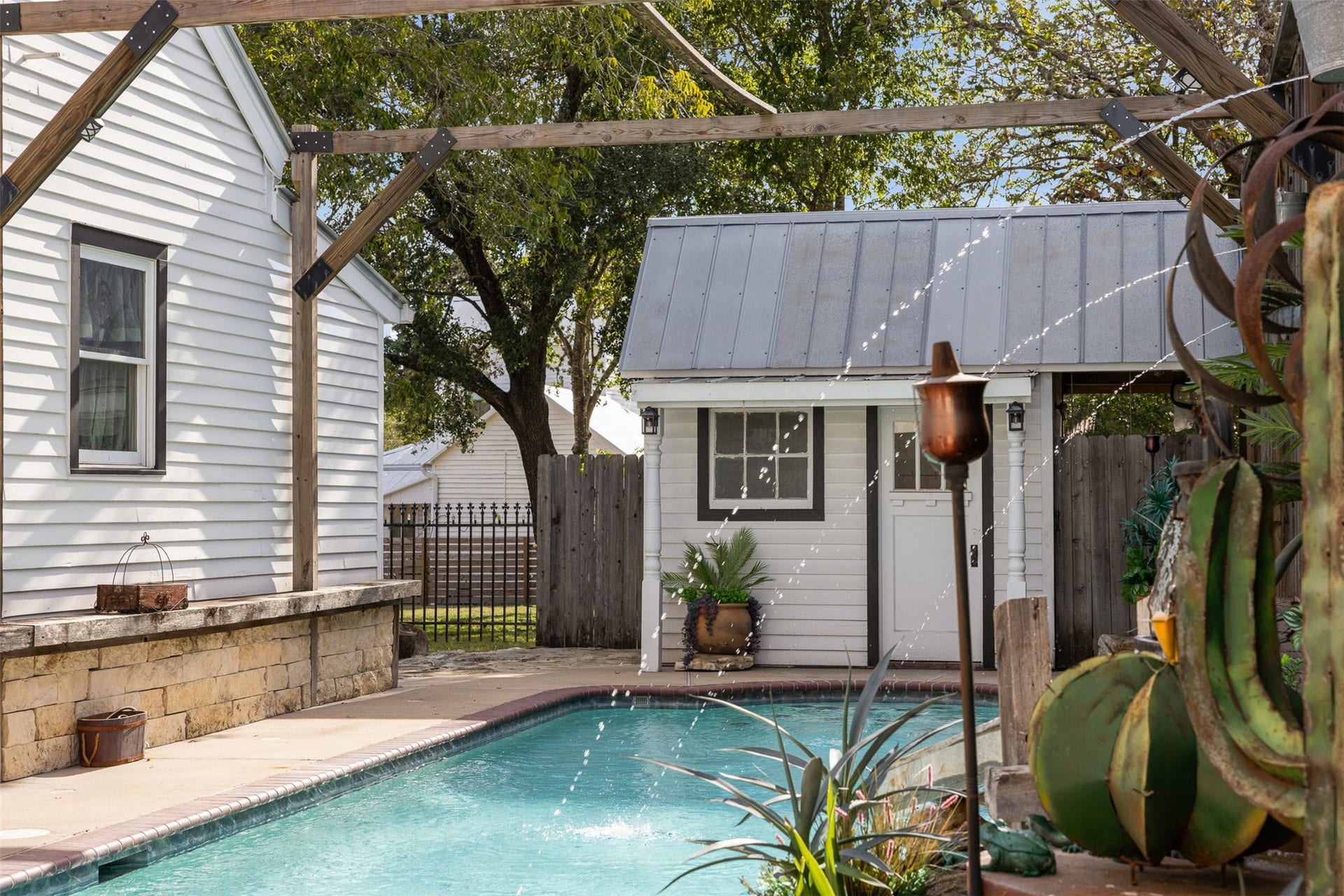326 W Colorado Street, La Grange, TX 78945 The pool house adds convenience and character to this inviting backyard escape.