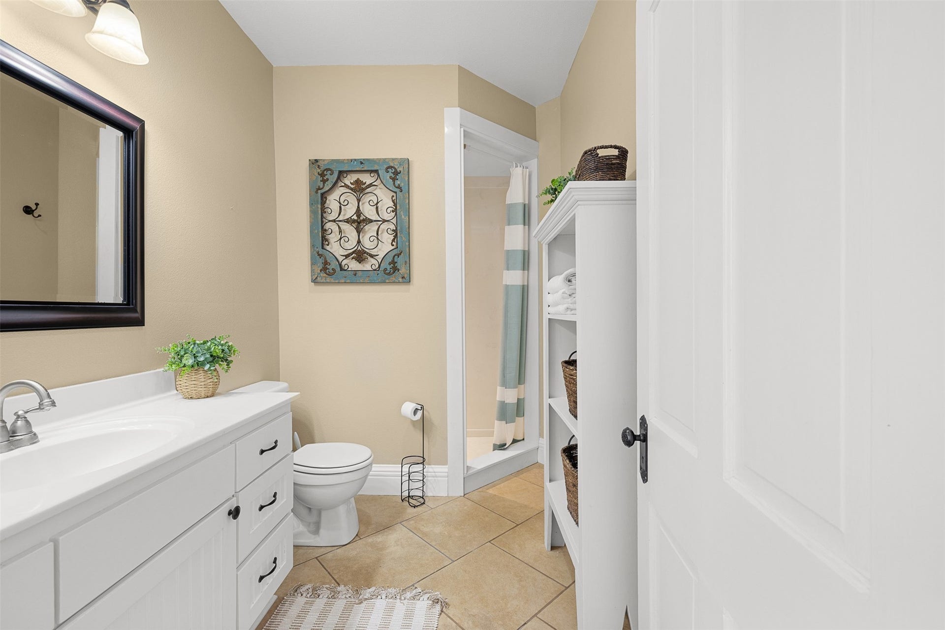 326 W Colorado Street, La Grange, TX 78945 The updated upstairs bath serves the secondary bedrooms with a vanity, shower and clean, comfortable finishes.