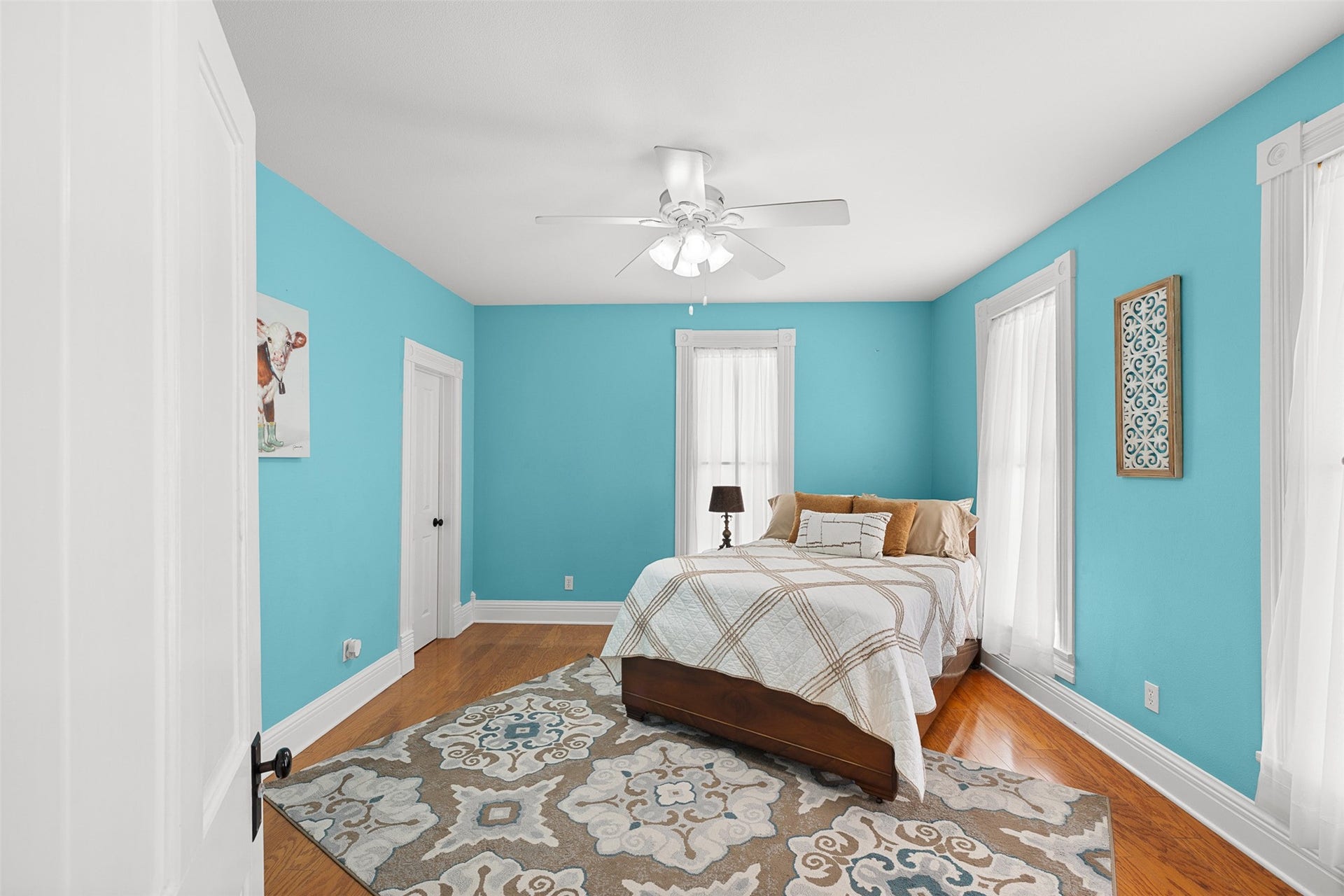 326 W Colorado Street, La Grange, TX 78945 This cheerful upstairs bedroom features wood flooring, high ceilings and lovely natural light.