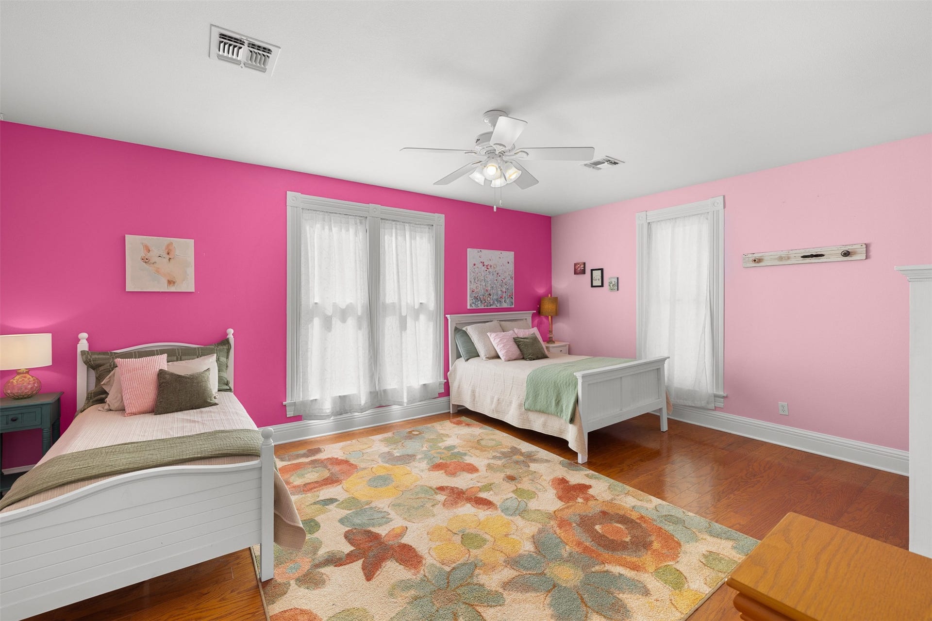 326 W Colorado Street, La Grange, TX 78945 Bright and playful, this generously sized upstairs bedroom provides a welcoming retreat with abundant natural light.