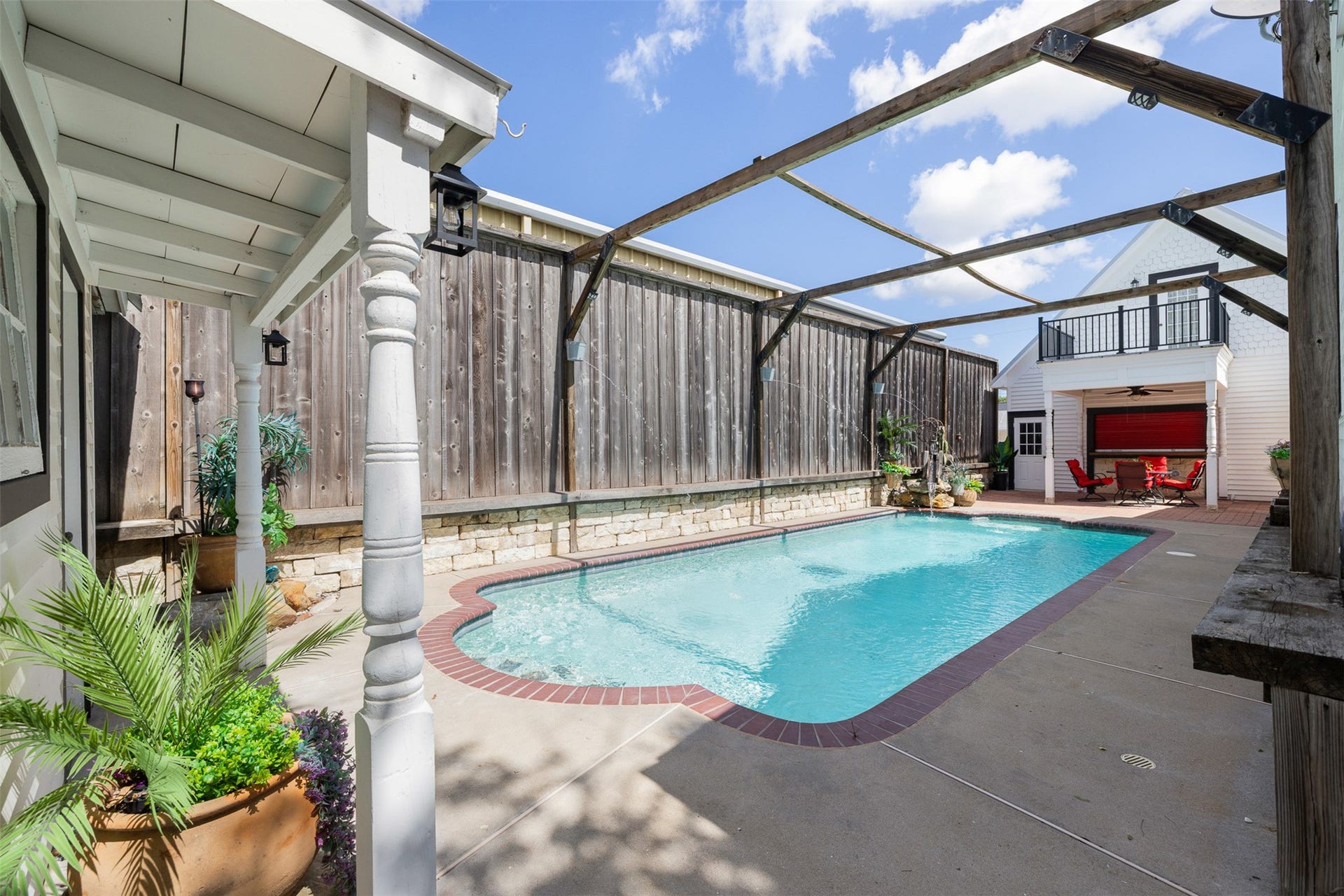 326 W Colorado Street, La Grange, TX 78945 The private in-ground pool creates a refreshing retreat surrounded by fencing and outdoor living spaces.