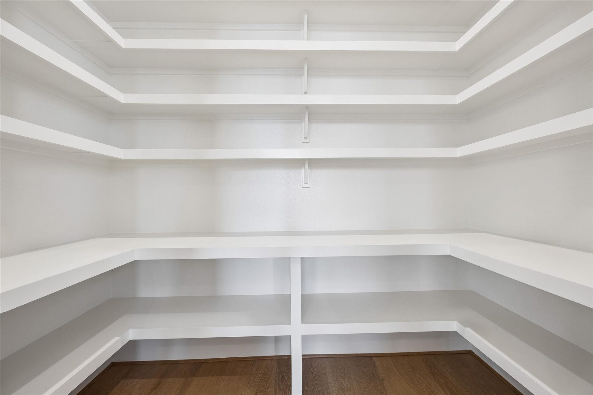 335 Harvard Street, Houston, TX 77007 An oversized walk in pantry provides exceptional storage with wraparound shelving designed to keep everyday essentials organized and within easy reach.