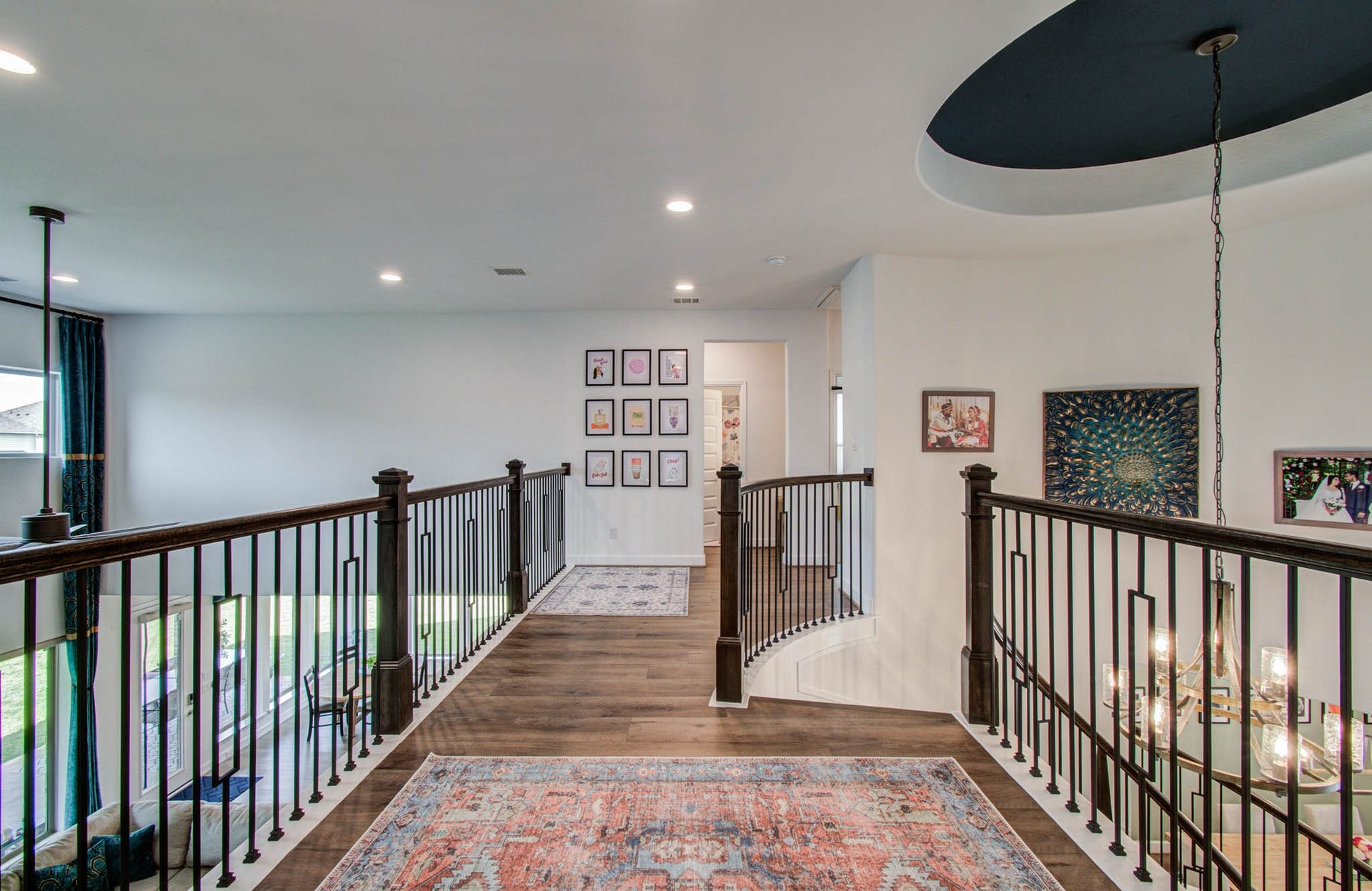 24430 Switchgrass Valley Way, Katy, TX 77493 A stylish landing effortlessly separates the vibrant game room from the cozy bedrooms, offering both functionality and elegance.