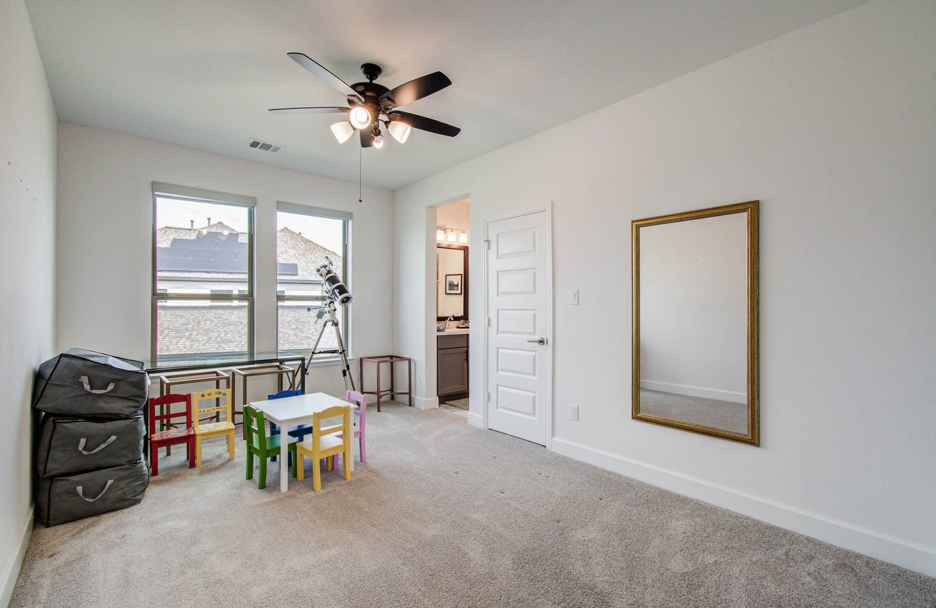 24430 Switchgrass Valley Way, Katy, TX 77493 secondary bedroom with roller shades, ceiling fan and jack and jill bath.