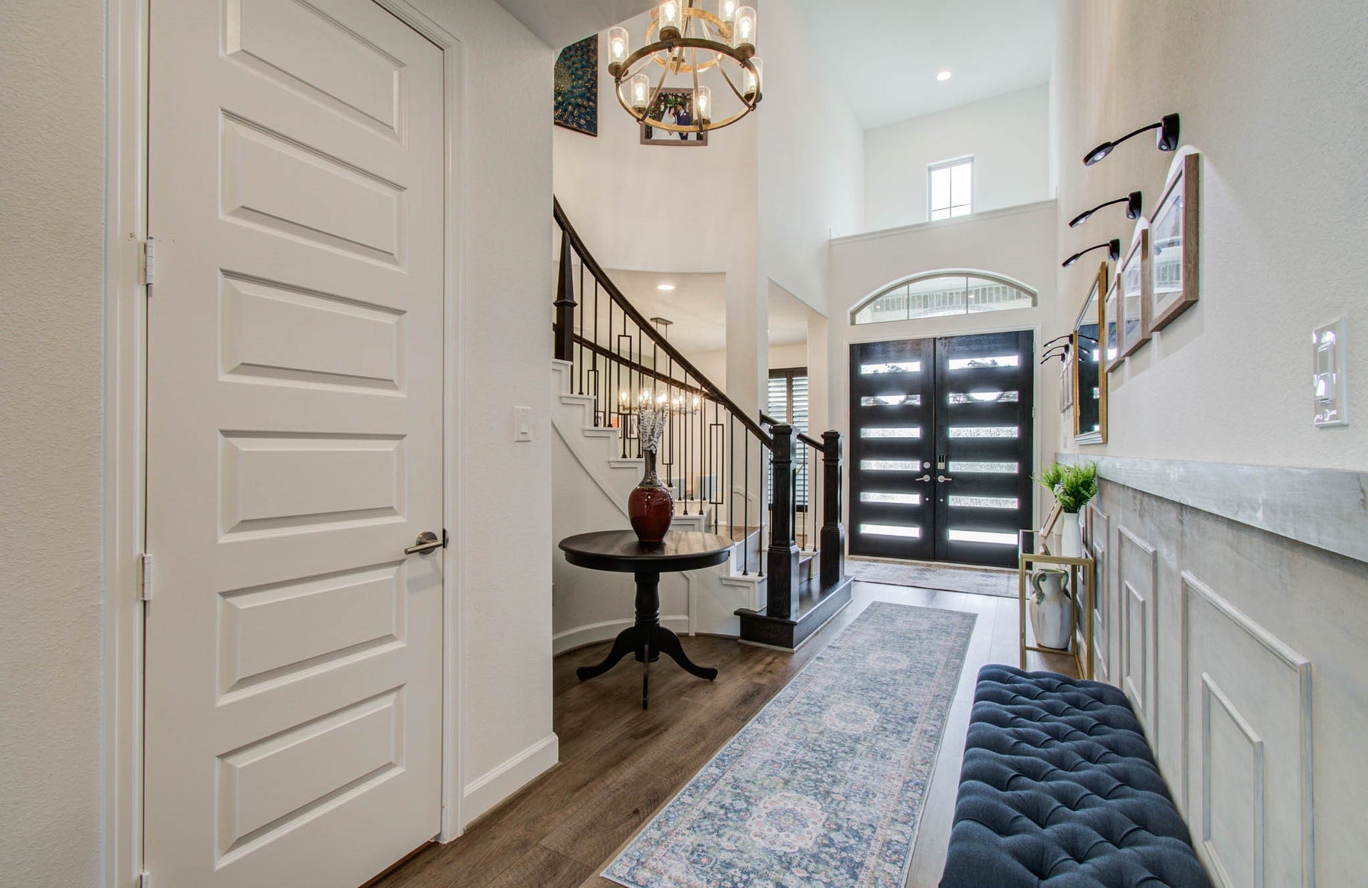24430 Switchgrass Valley Way, Katy, TX 77493 A grand cathedral entryway greets you with elegance, highlighted by an upgraded light fixture that adds a modern touch to the welcoming space.