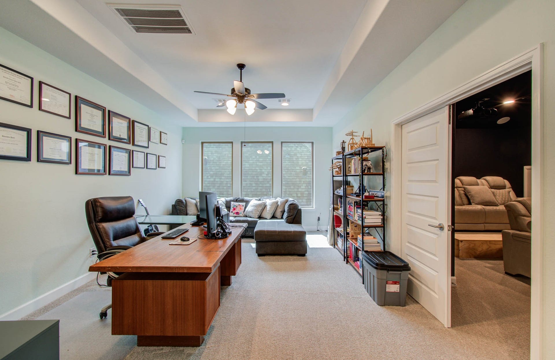 24430 Switchgrass Valley Way, Katy, TX 77493 Upstairs, a versatile gameroom is currently transformed into a stylish and functional office space, perfect for remote work or study.