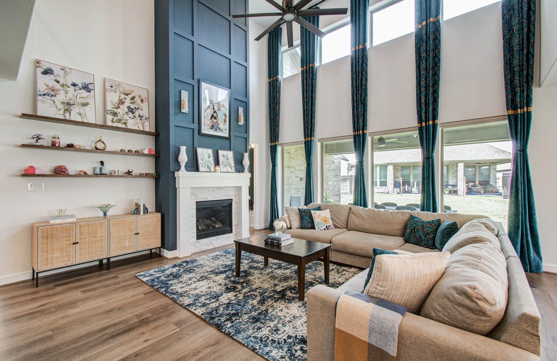 24430 Switchgrass Valley Way, Katy, TX 77493 Experience luxury and convenience in this elegant living room, where soaring ceilings and abundant natural light are complemented by sleek electric roller shades for effortless ambiance control.