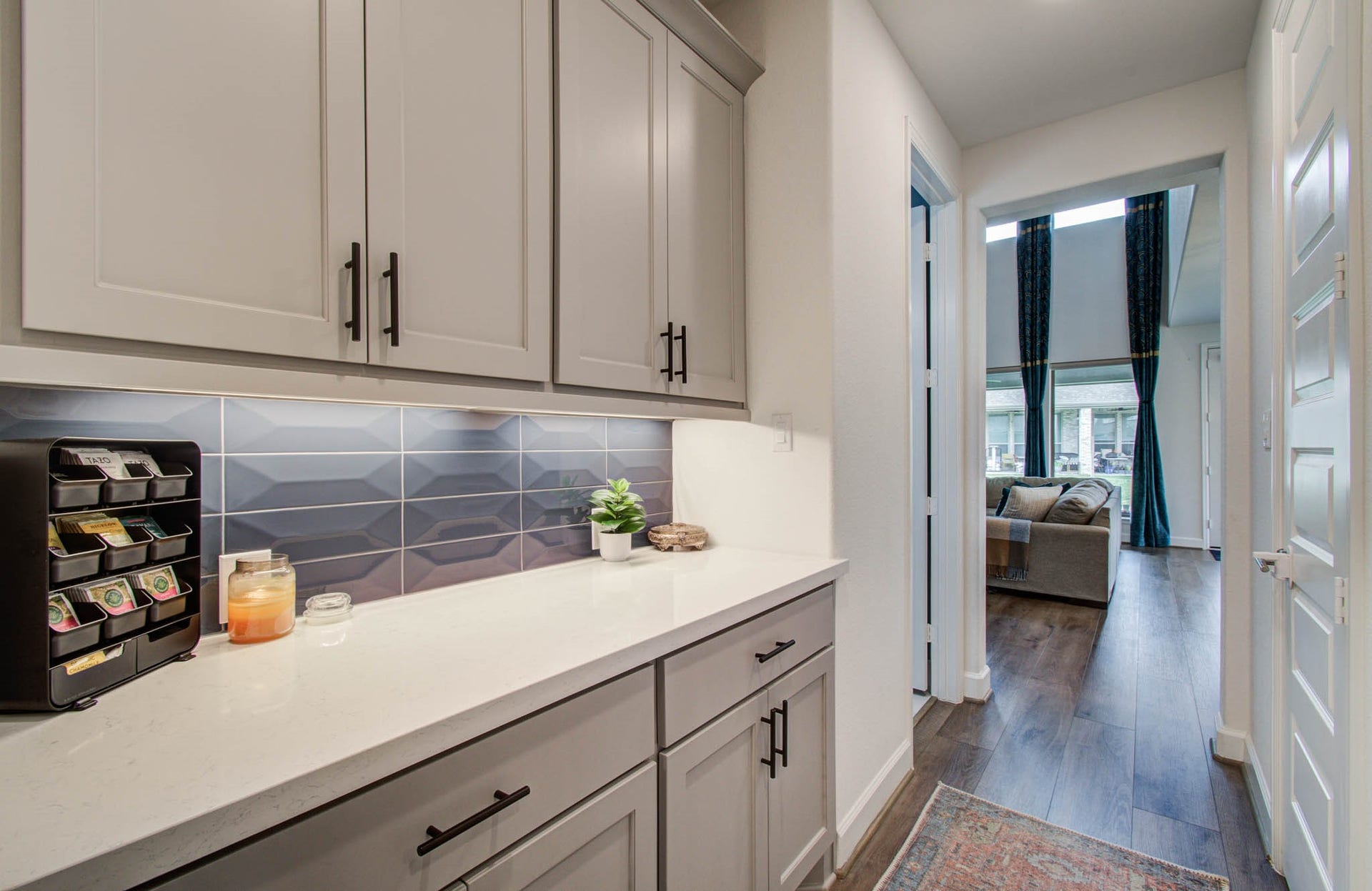 24430 Switchgrass Valley Way, Katy, TX 77493 Versatile coffee bar or butler's pantry featuring sleek cabinetry and ample storage for all your essentials.