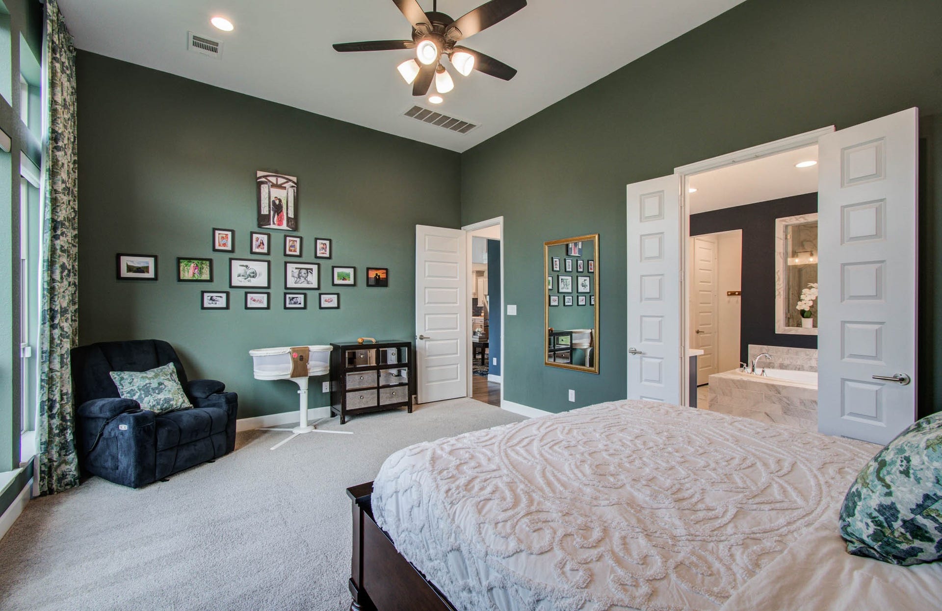 24430 Switchgrass Valley Way, Katy, TX 77493 The room connects to a modern bathroom with double doors, adding a luxurious touch.