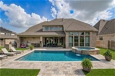 24430 Switchgrass Valley Way, Katy, TX 77493 AI generated pool and outdoor kitchen showing the room possible for a pool area with the large 12,216 sq foot yard.