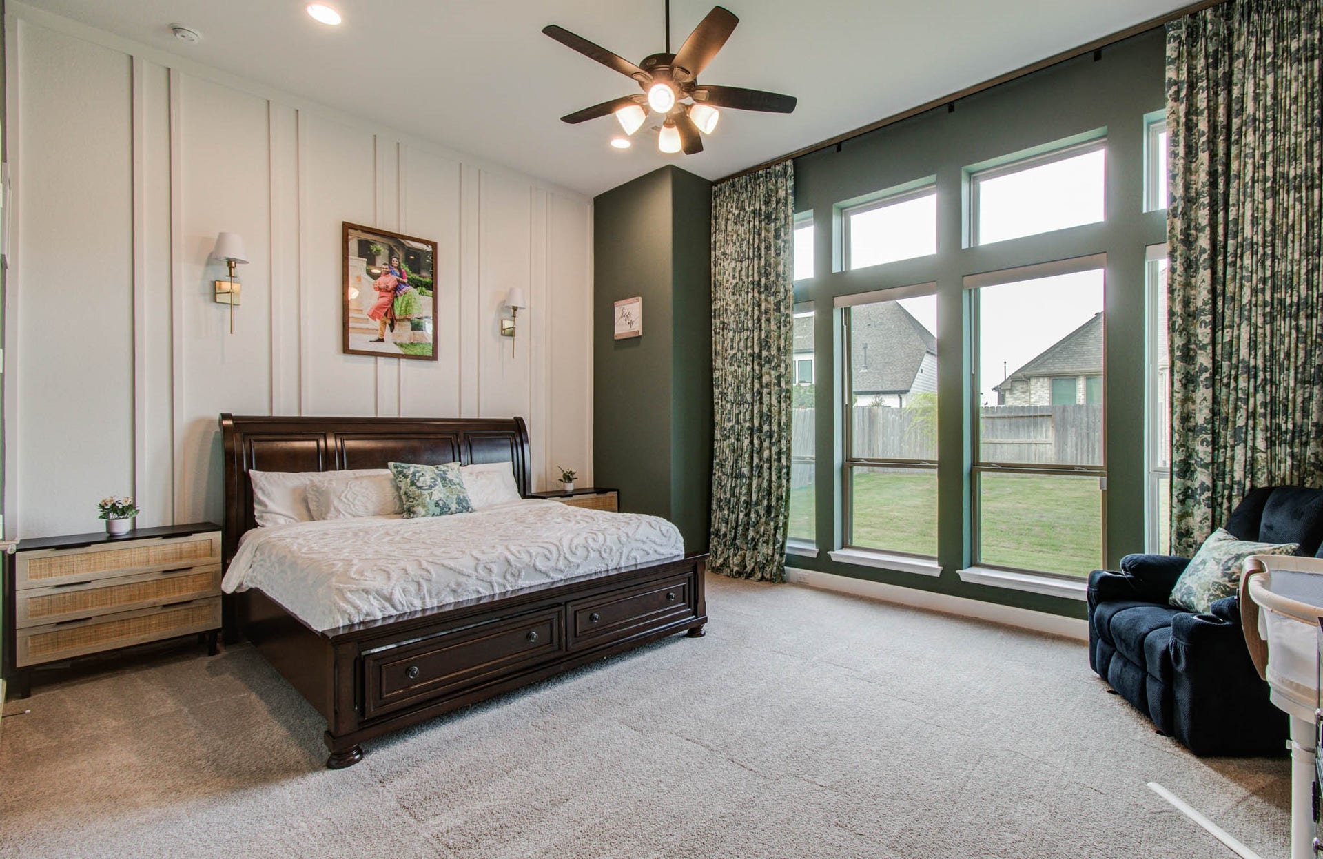24430 Switchgrass Valley Way, Katy, TX 77493 This spacious bedroom features large windows providing ample natural light, elegant paneled walls, and a ceiling fan. Welcoming and comfortable atmosphere.