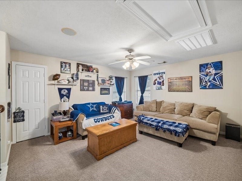Upstairs game room offers flexible space for entertainment, work or hobbies.