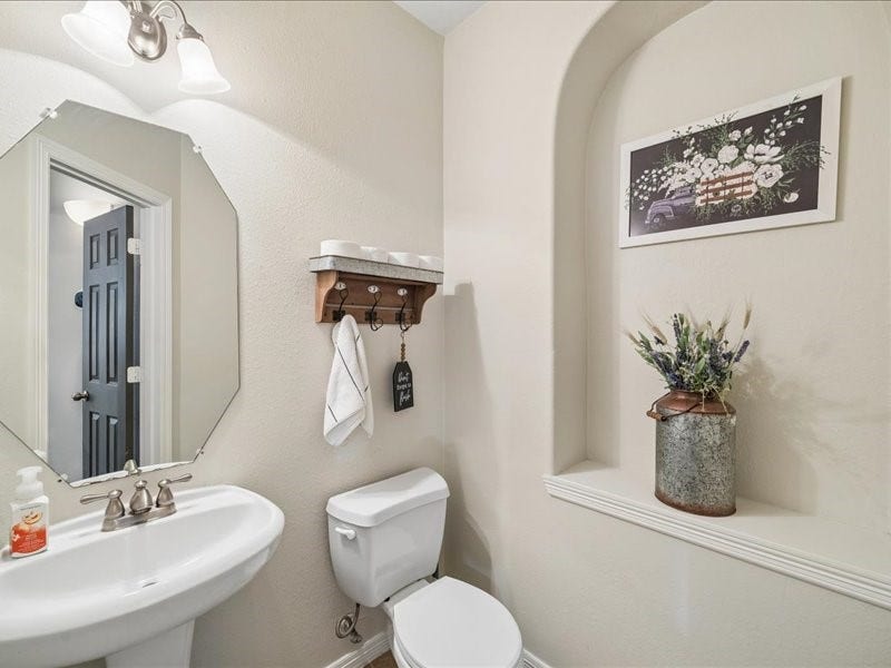Convenient first-floor powder room for guests.