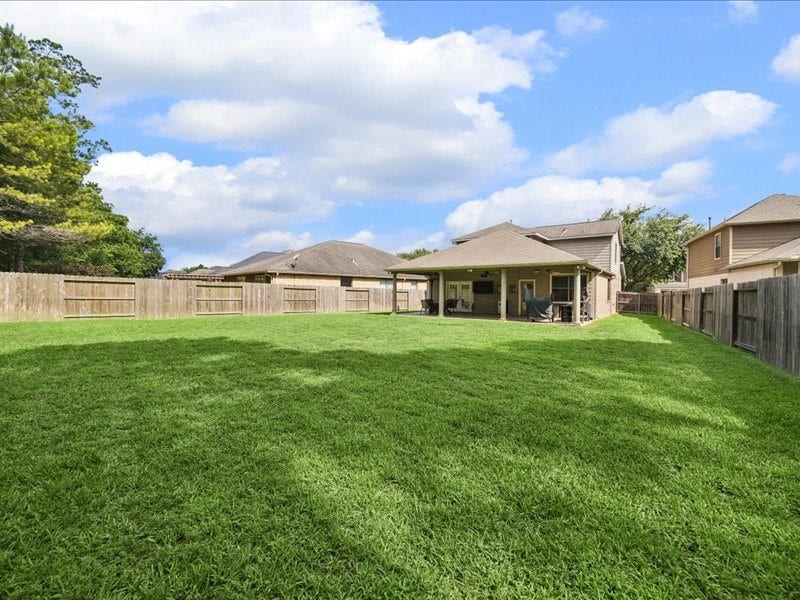 Wide backyard provides room to garden, play or personalize the outdoor space.