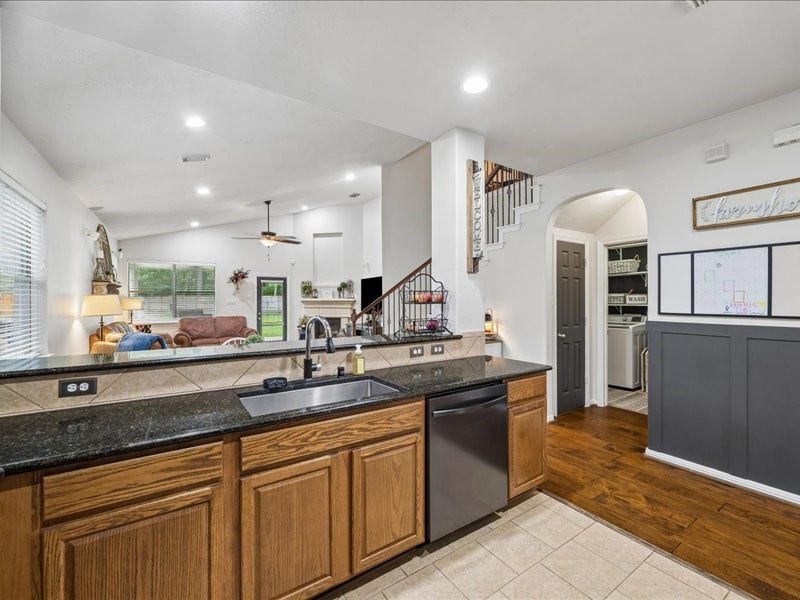 Open sightlines connect the kitchen, breakfast area and living room.