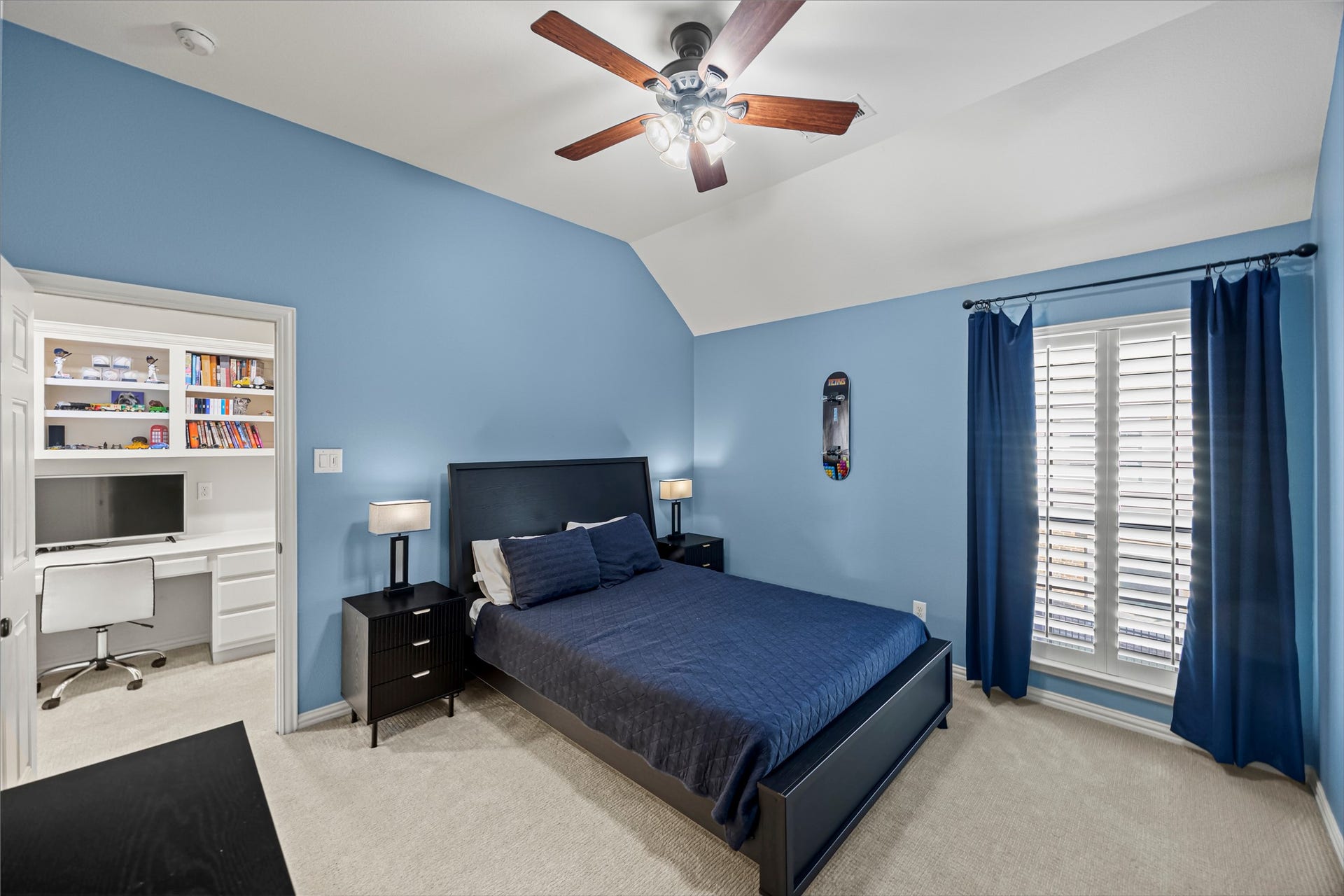 8642 Chickasaw Plum Way, Katy, TX 77494 Bedroom with custom built-in shelving, ceiling fan, and natural light.