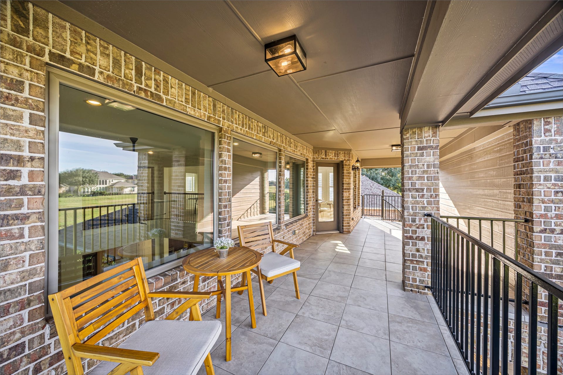 8642 Chickasaw Plum Way, Katy, TX 77494 Covered balcony with outdoor seating overlooking the grounds