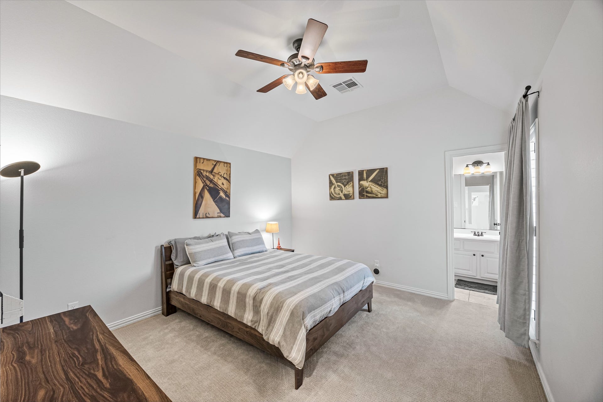 8642 Chickasaw Plum Way, Katy, TX 77494 Bright bedroom with ceiling fan, large windows, and plush carpet.