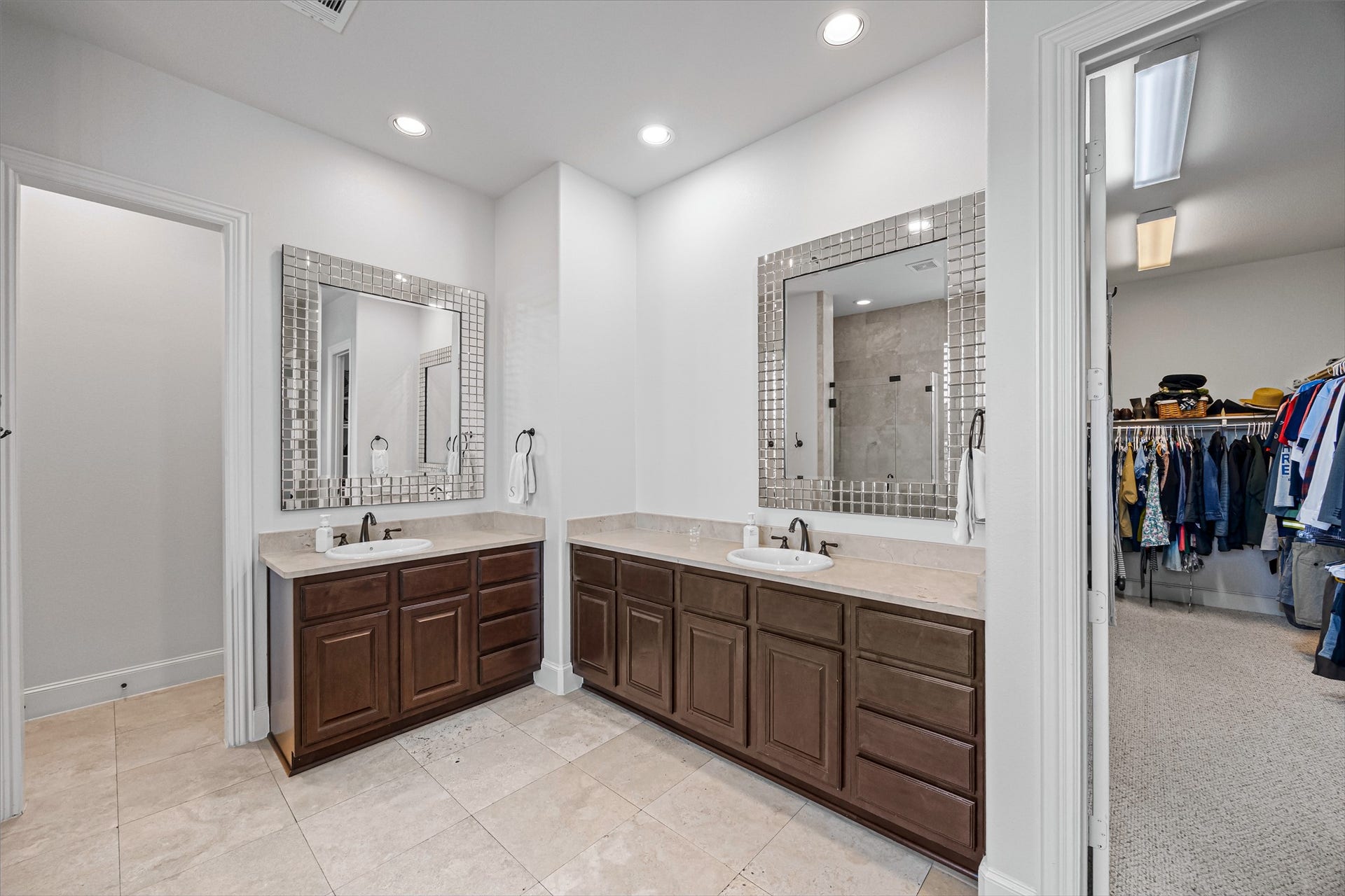 8642 Chickasaw Plum Way, Katy, TX 77494 Primary bath with dual vanities, ample counter space, and access to the closet. All new lighting on dimmers. Updated paint throughout.