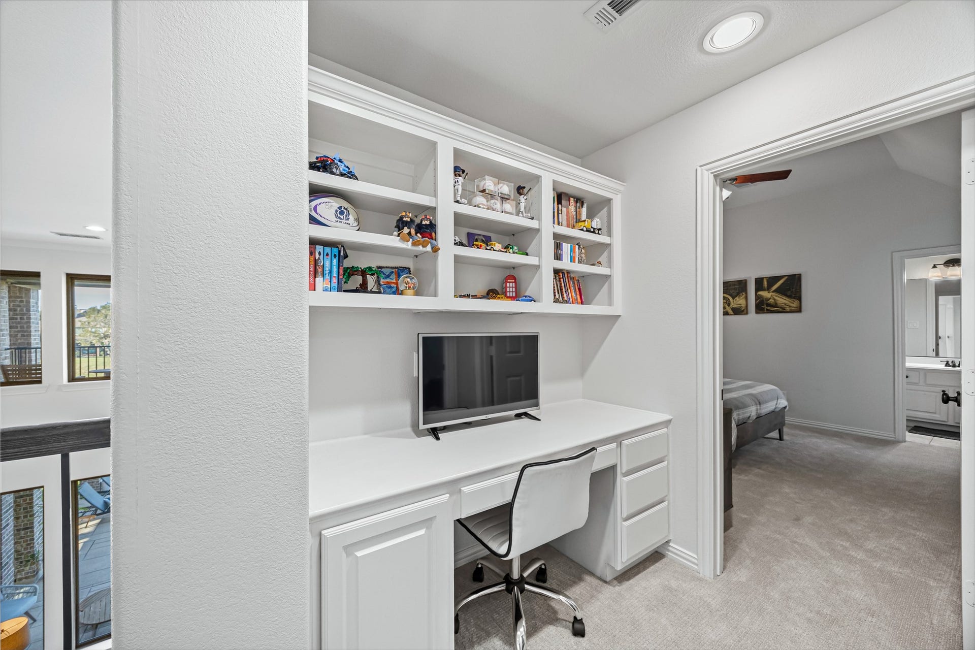 8642 Chickasaw Plum Way, Katy, TX 77494 Built-in desk and custom shelving creating a functional workspace