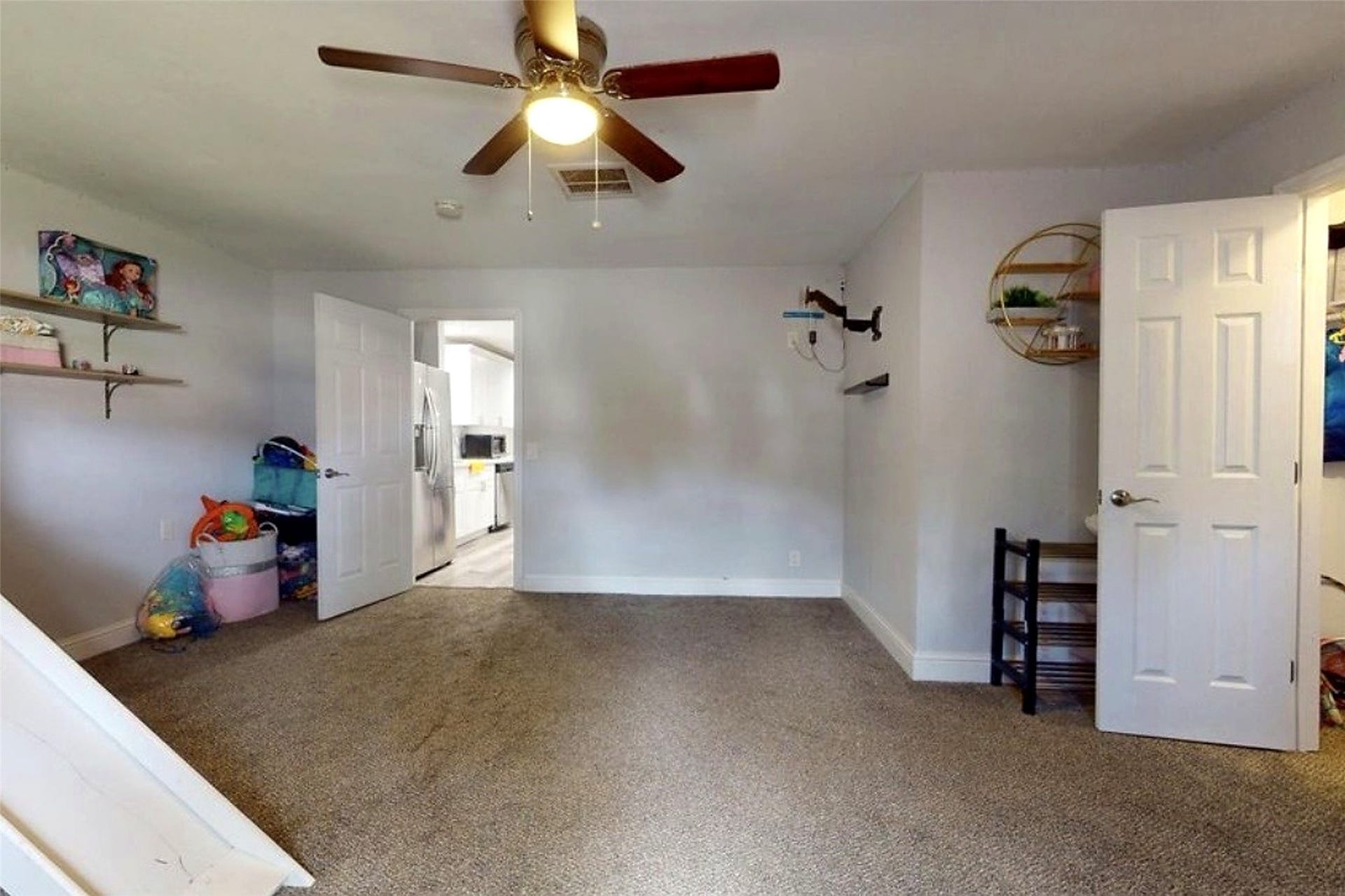 827 Dondell Street, Channelview, TX 77530 827 Dondell, Large currently used as a bedroom, can be used as a game room or office, large walk through closet and a bay window with tan carpet.