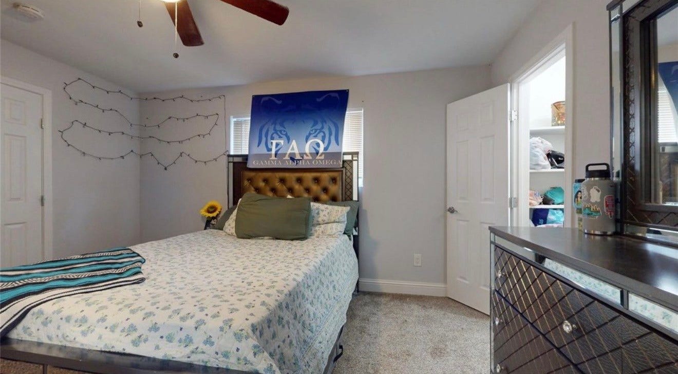 827 Dondell Street, Channelview, TX 77530 827 Dondell, 2nd Primary bedroom with it's own bathroom and walk-in closet, tan carpet and ceiling fan