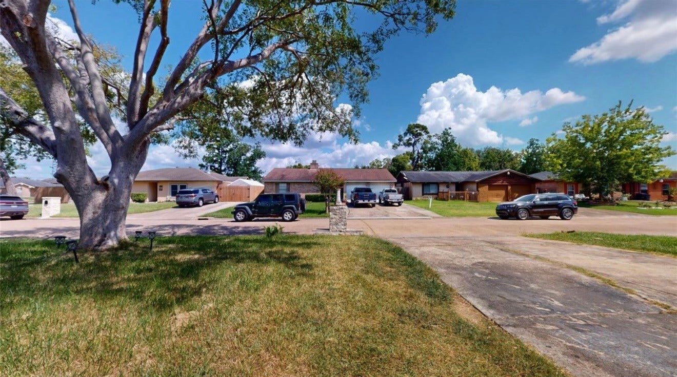 827 Dondell Street, Channelview, TX 77530 827 Dondell, view to neighborhood from front door with a mature large tree.