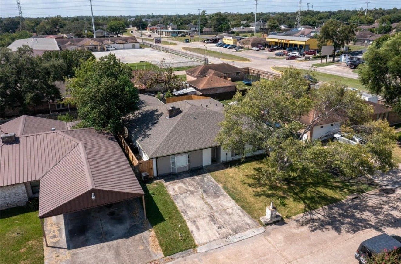 827 Dondell Street, Channelview, TX 77530 827 Dondell, Arial view of single story home with mature shade trees and extended driveway and a welcoming front yard.