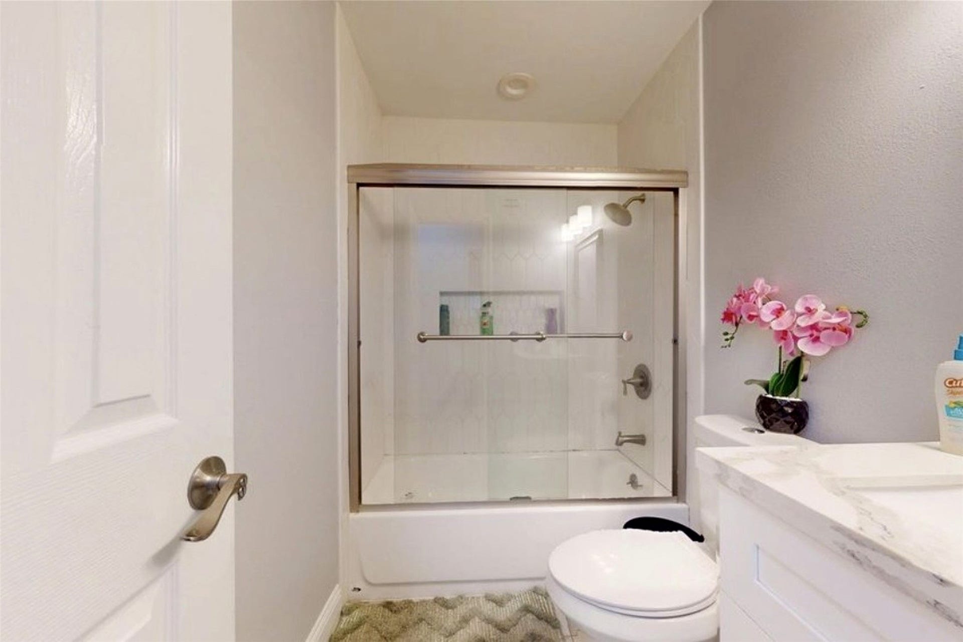 827 Dondell Street, Channelview, TX 77530 827 Dondell, 3rd full bathroom with white tub and sliding door to shower.