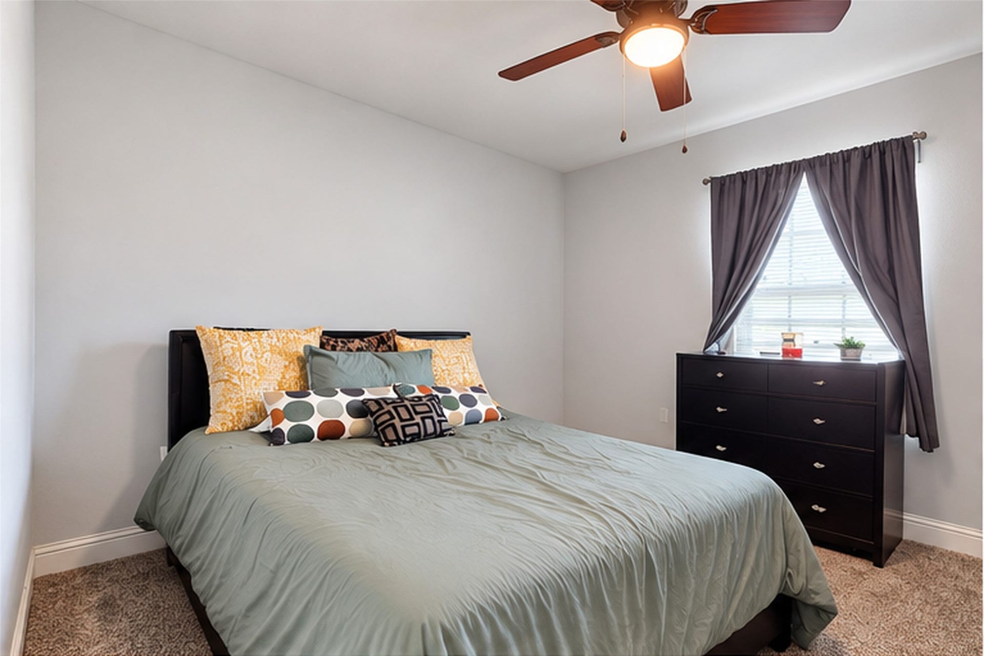 827 Dondell Street, Channelview, TX 77530 827 Dondell, 4th bedroom with tan carpet, ceiling fan and large window for natural lighting.
