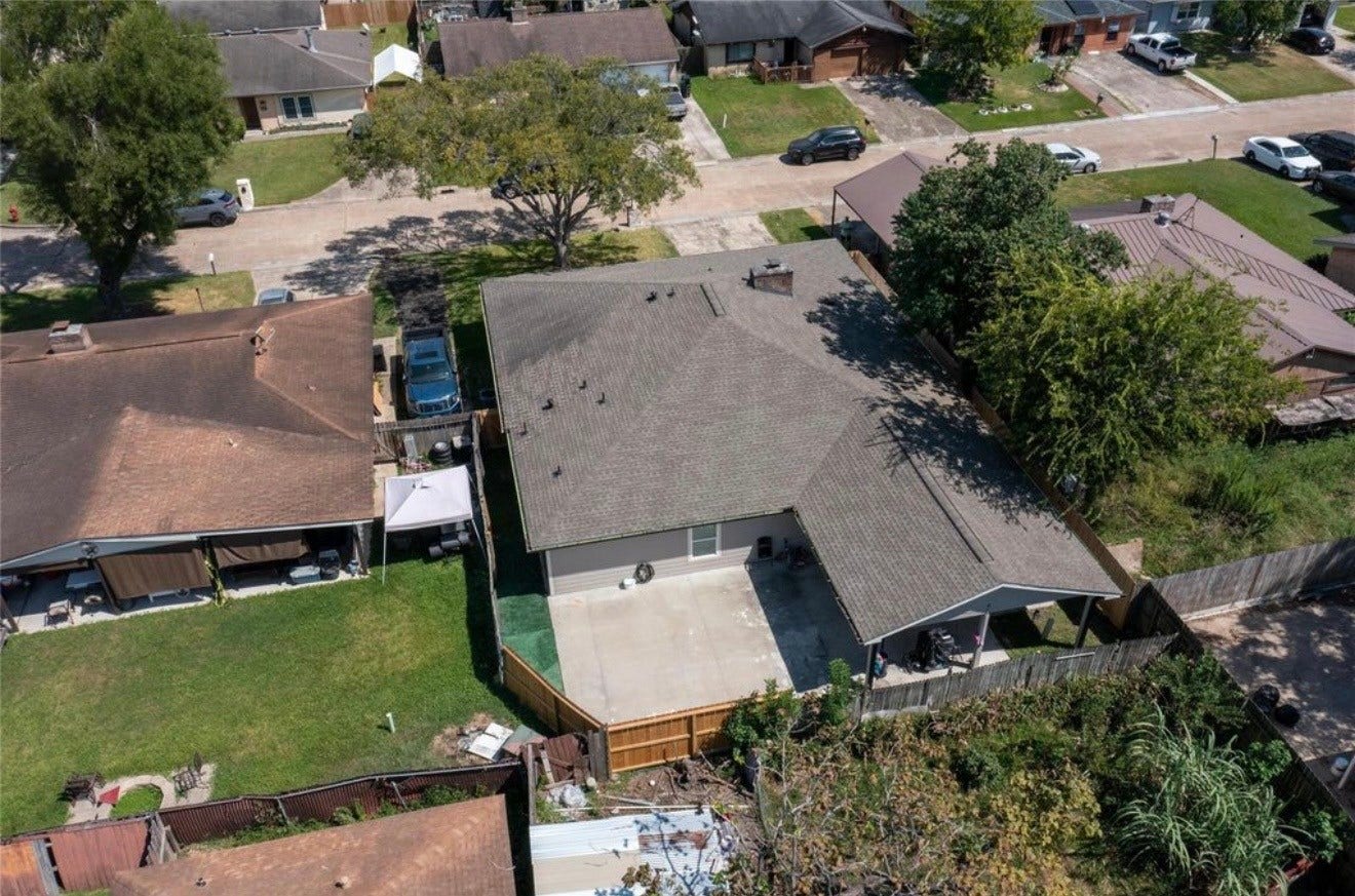 827 Dondell Street, Channelview, TX 77530 827 Dondell, Arial backyard view of home with concrete extended patio.